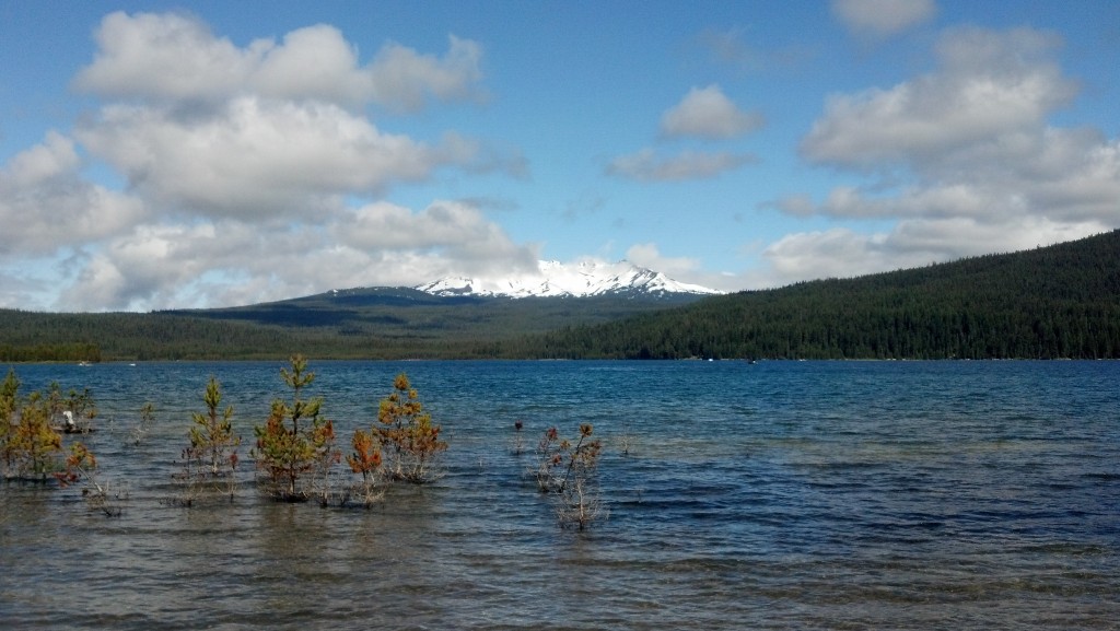 A snow capped peak across the lake from the camp site.