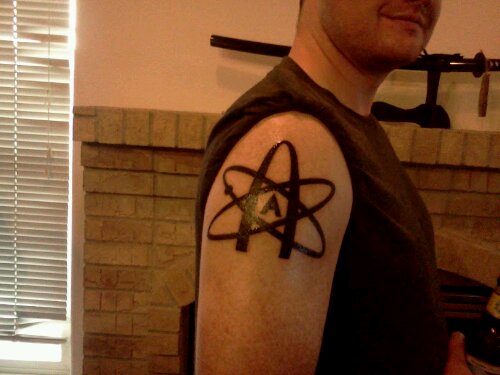 The American Atheist logo tattooed on my arm.